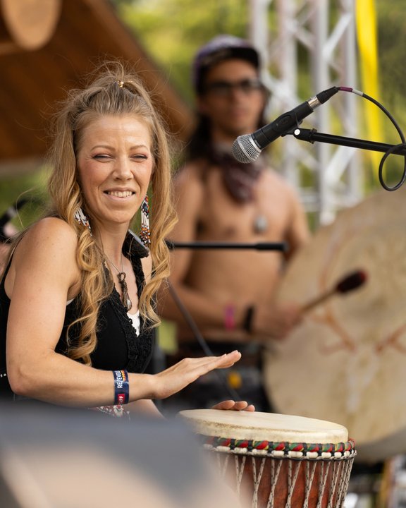Musicians playing hand drums outdoors