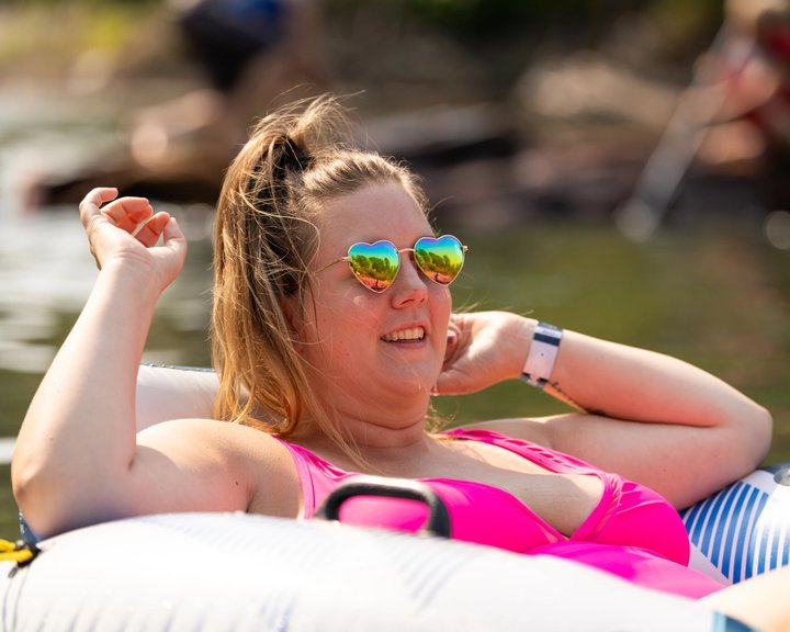 Festival attendee relaxing on a river float