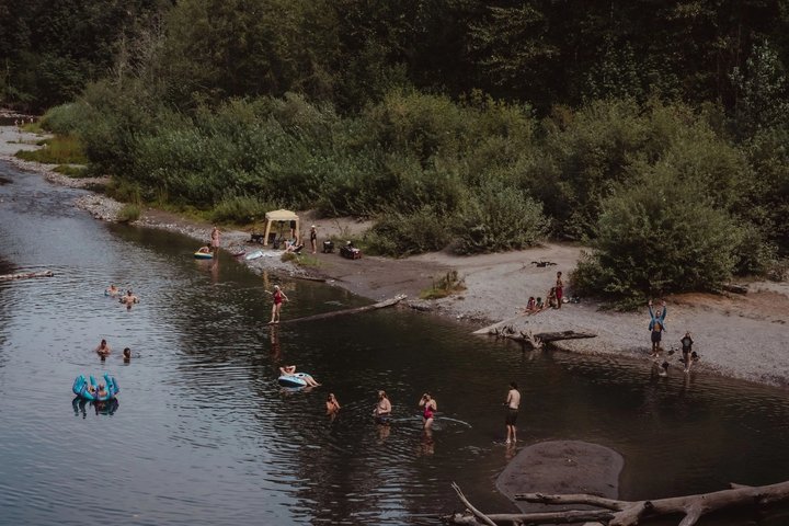 Festival attendees cooling off in the river