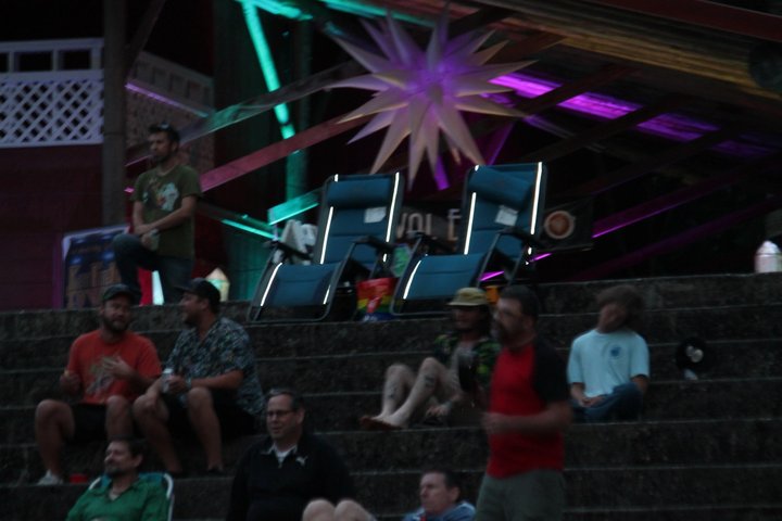 Colorful geometric decorations above the audience seating
