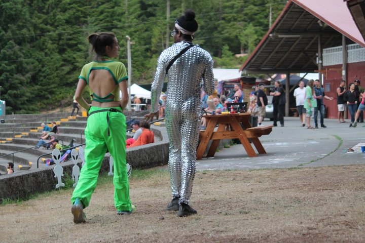 Two people walking beside the amphitheater seating
