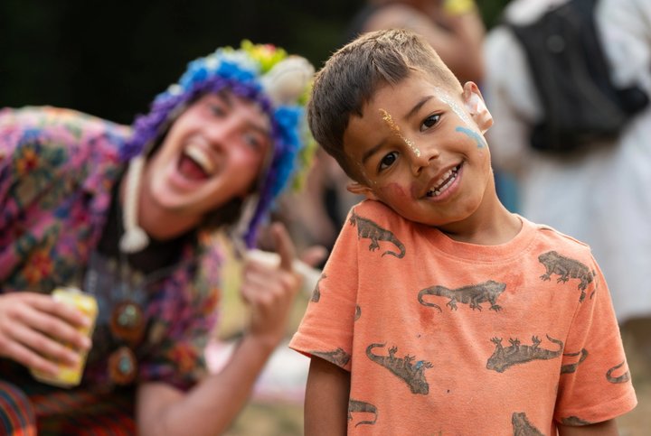 Festival attendees smiling and laughing outdoors