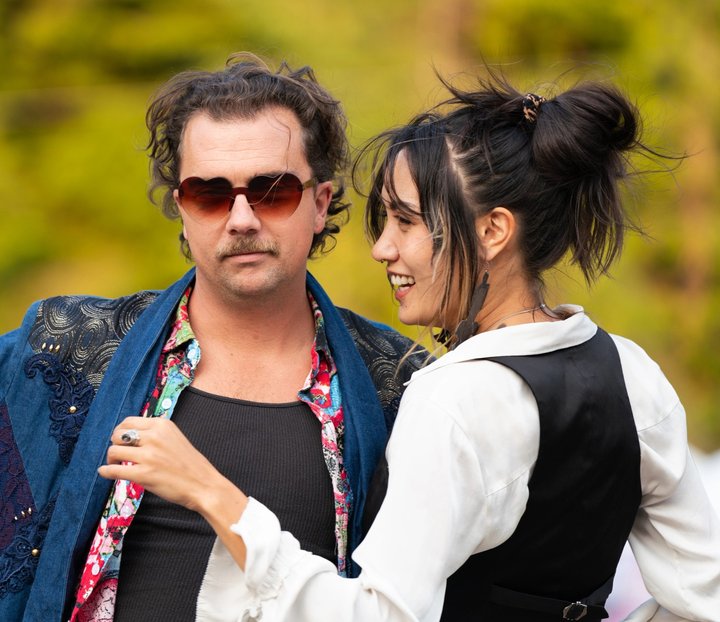 Two festival attendees spending time together outdoors